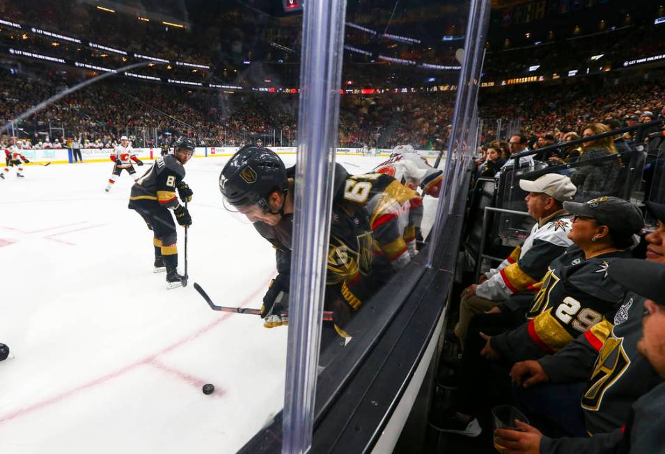 Golden Knights right wing Mark Stone (61) moves the puck against the Calgary Flames during the first period of an NHL hockey game at T-Mobile Arena in Las Vegas on Wednesday, March 6, 2019. (Chase ...