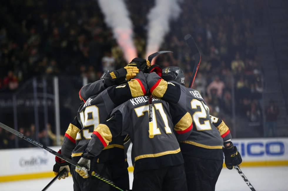 Golden Knights players celebrate a goal against the Calgary Flames during the first period of an NHL hockey game at T-Mobile Arena in Las Vegas on Wednesday, March 6, 2019. (Chase Stevens/Las Vega ...