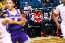 Former Liberty basketball player Dre'Una Edwards, who now plays for Utah, cheers her team on as they play Washington during the Pac-12 women's basketball tournament at the MGM Grand Garden Arena i ...
