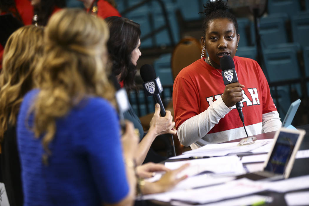 Former Liberty basketball player Dre'Una Edwards, who now plays for Utah, is interviewed on the Pac-12 Network before her team plays Washington in the Pac-12 women's basketball tournament at the M ...