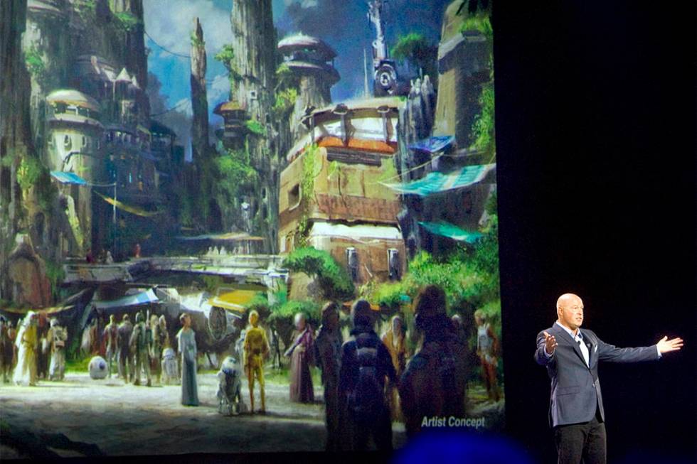 Bob Chapek, chairman of Walt Disney Parks and Resorts, speaks in front of concept art of the newly announced Star Wars Land, Aug. 15, 2015. Disney CEO Bob Iger said Tuesday, Feb. 7, 2017, the comp ...