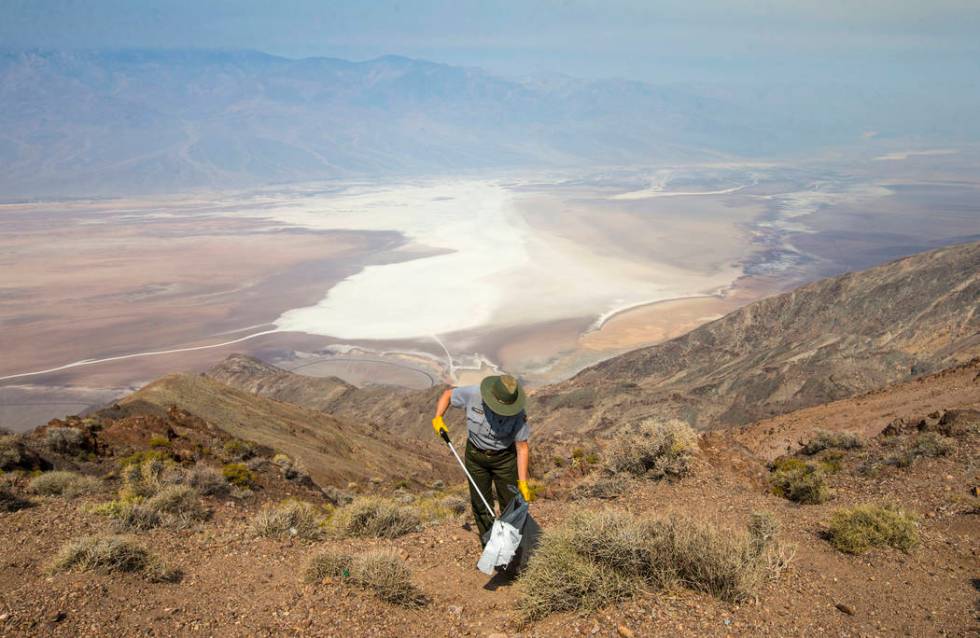 Death Valley National Park custodian Terry Eddington picks up trash at Dante's View in Death Valley National Park, Calif., on Tuesday, Aug. 7, 2018. (Chase Stevens Las Vegas Review-Journal @csstev ...