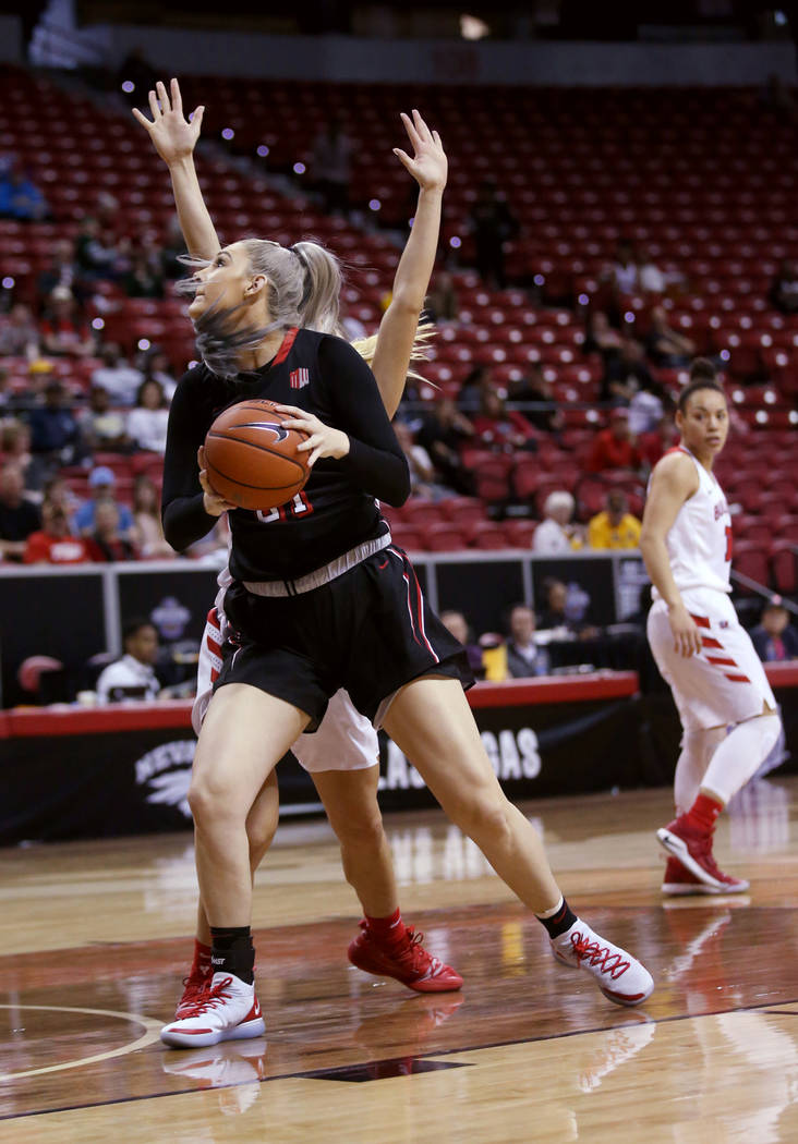 UNLV Lady Rebels forward Katie Powell (21) looks to shoot against Fresno State in the first quarter of their quarterfinal game of the Mountain West women's basketball tournament at the Thomas &amp ...