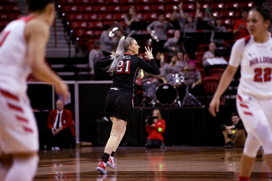 UNLV Lady Rebels forward Katie Powell (21) reacts to a three-point basket against Fresno State in the first quarter of their quarterfinal game of the Mountain West women's basketball tournament at ...
