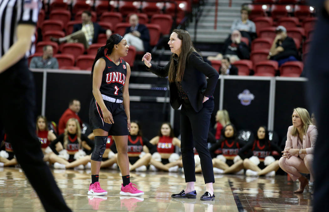 UNLV Lady Rebels head coach Kathy Olivier talks to guard Kavionnia Brown (1) in the first quarter of a quarterfinal game against Fresno State in the Mountain West women's basketball tournament at ...