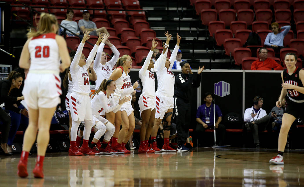 Fresno State players cheer a three-point basket against UNLV in the third quarter of their quarterfinal game in the Mountain West women's basketball tournament at the Thomas & Mack Center in L ...