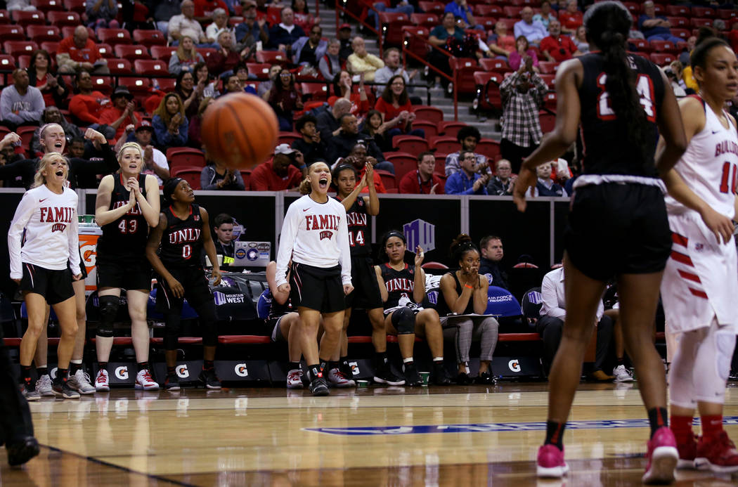 UNLV players react to a basket in the final minutes of their quarterfinal against Fresno State during their quarterfinal game in the Mountain West women's basketball tournament at the Thomas & ...