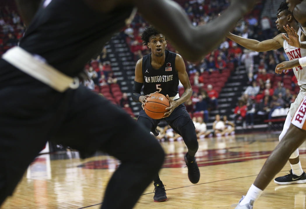 San Diego State Aztecs forward Jalen McDaniels (5) brings the ball up court against UNLV during the first half of a basketball game at the Thomas & Mack Center in Las Vegas on Saturday, Feb. 2 ...