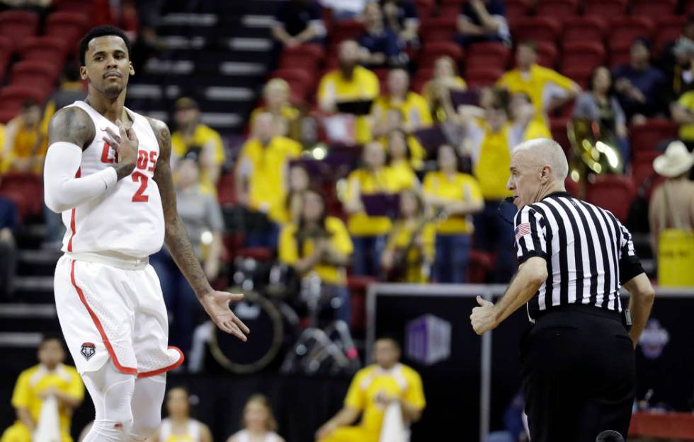 New Mexico's Corey Henson (2) reacts after sinking a 3-point shot during the second half of an NCAA college basketball game against Wyoming in the Mountain West Conference tournament, Wednesday, M ...