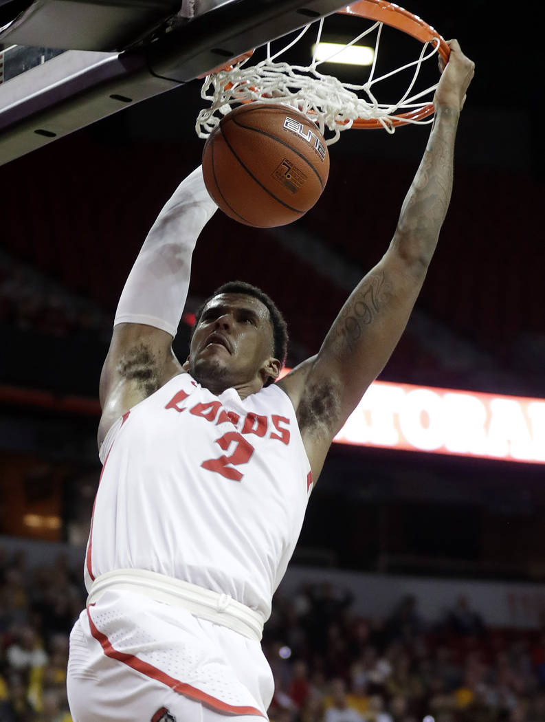 New Mexico's Corey Henson dunks during the second half of the team's NCAA college basketball game against Wyoming in the Mountain West Conference men's tournament Wednesday, March 13, 2019, in Las ...