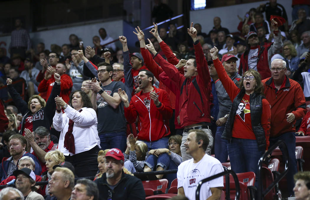 UNLV fans cheer during the second half of a quarterfinal game against San Diego State in the Mountain West men's basketball tournament at the Thomas & Mack Center in Las Vegas on Thursday, Mar ...