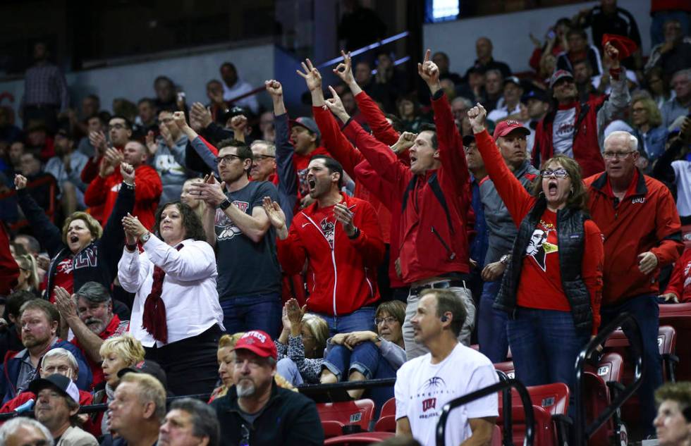 UNLV fans cheer during the second half of a quarterfinal game against San Diego State in the Mountain West men's basketball tournament at the Thomas & Mack Center in Las Vegas on Thursday, Mar ...