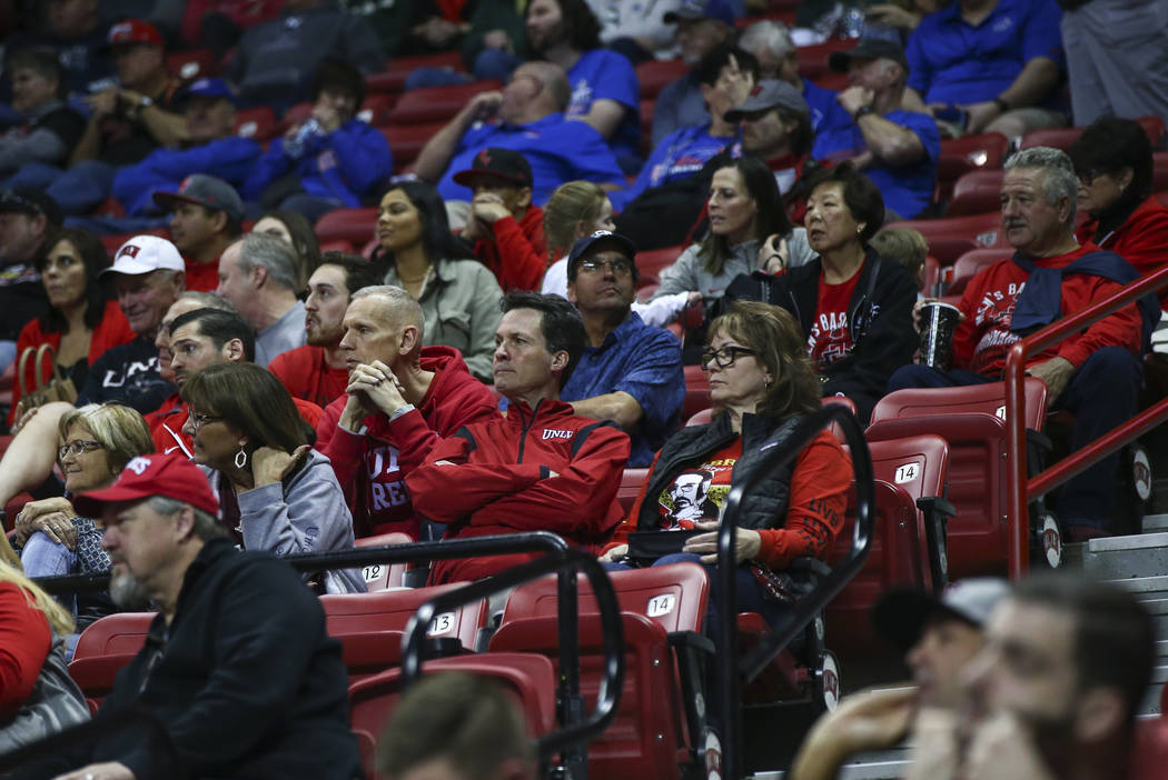 UNLV fans react during the second half of a quarterfinal game against San Diego State in the Mountain West men's basketball tournament at the Thomas & Mack Center in Las Vegas on Thursday, Mar ...