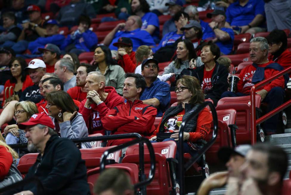 UNLV fans react during the second half of a quarterfinal game against San Diego State in the Mountain West men's basketball tournament at the Thomas & Mack Center in Las Vegas on Thursday, Mar ...