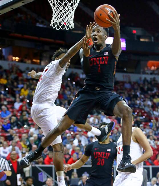 UNLV Rebels guard Kris Clyburn (1) goes to the basket against San Diego State Aztecs guard Jeremy Hemsley during the second half of a quarterfinal game in the Mountain West men's basketball tourna ...