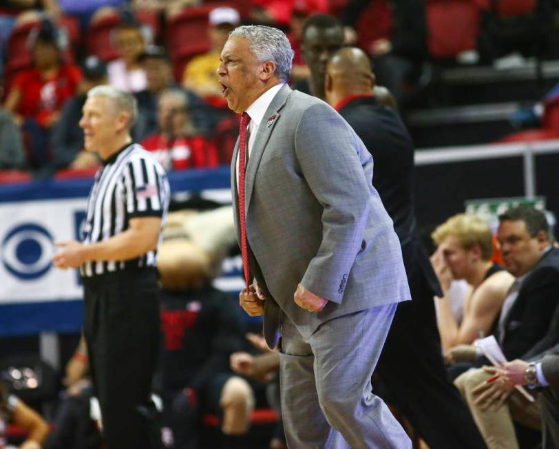 UNLV Rebels head coach Marvin Menzies reacts during the first half of a quarterfinal game against San Diego State in the Mountain West men's basketball tournament at the Thomas & Mack Center i ...