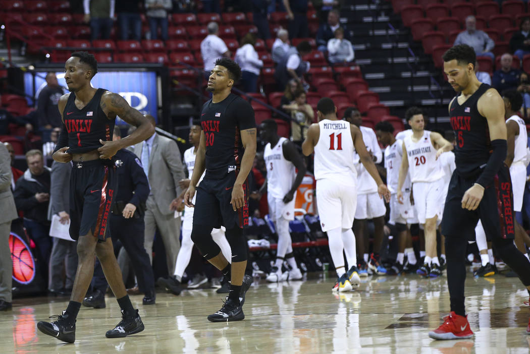 UNLV players walk off court after losing to San Diego State in a quarterfinal game at the Mountain West men's basketball tournament at the Thomas & Mack Center in Las Vegas on Thursday, March ...