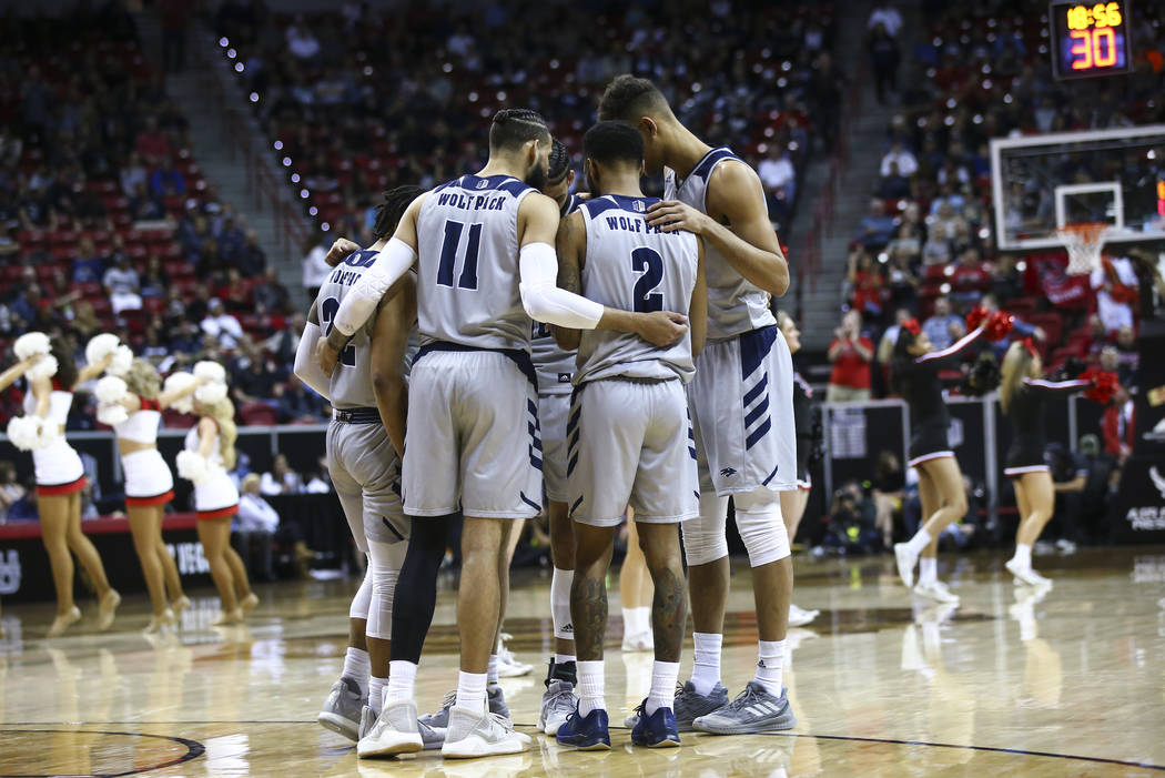 UNR players huddle during the second half of a semifinal basketball game against San Diego State in the Mountain West men's basketball tournament at the Thomas & Mack Center in Las Vegas on Fr ...