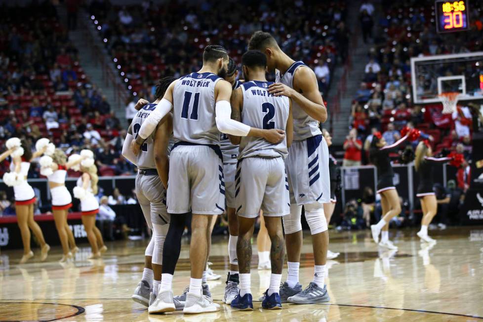 UNR players huddle during the second half of a semifinal basketball game against San Diego State in the Mountain West men's basketball tournament at the Thomas & Mack Center in Las Vegas on Fr ...