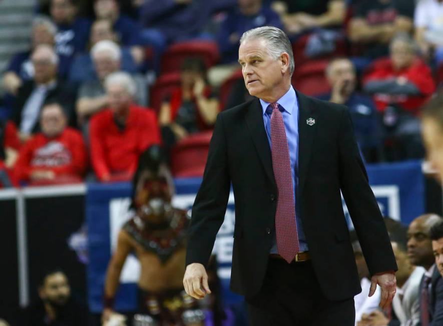 San Diego State Aztecs head coach Brian Dutcher looks on during the first half of a semifinal basketball game against UNR in the Mountain West men's basketball tournament at the Thomas & Mack ...