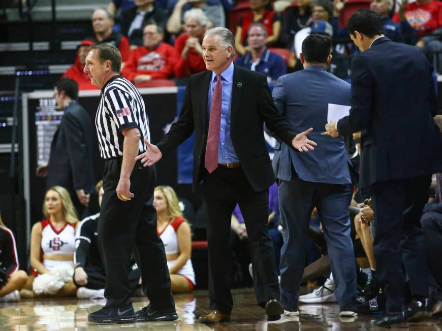 San Diego State Aztecs head coach Brian Dutcher reacts during the first half of a semifinal basketball game against UNR in the Mountain West men's basketball tournament at the Thomas & Mack Ce ...