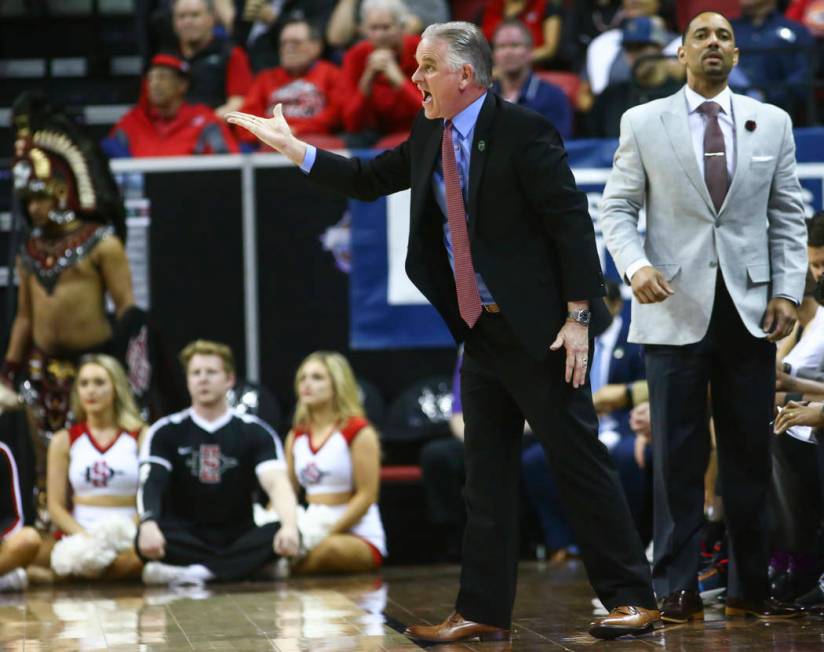 San Diego State Aztecs head coach Brian Dutcher reacts during the first half of a semifinal basketball game against UNR in the Mountain West men's basketball tournament at the Thomas & Mack Ce ...