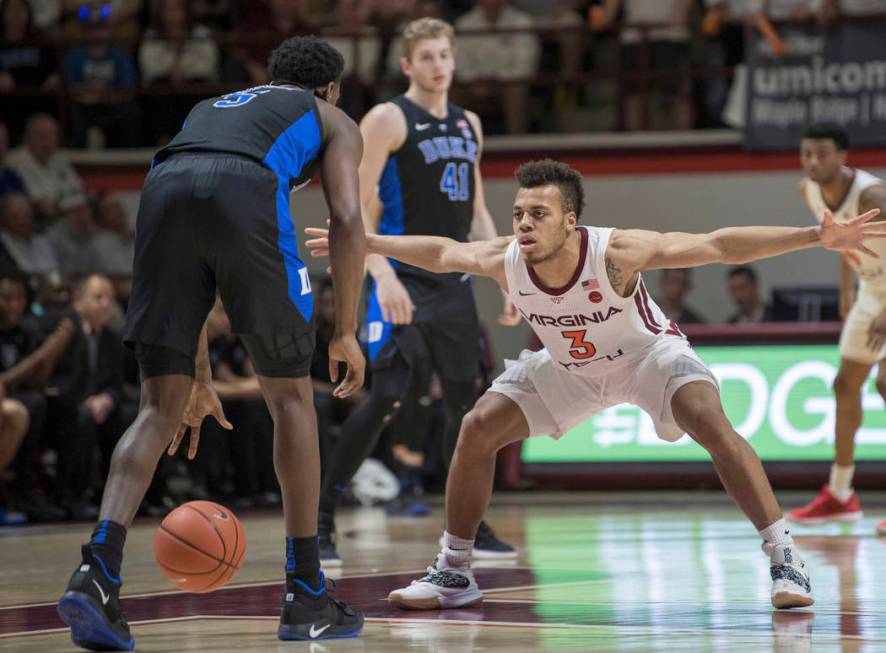 Virginia Tech's Wabissa Bede (3) defends against Duke forward RJ Barrett (5) during the second half of an NCAA college basketball game in Blacksburg, Va., Tuesday, Feb. 26, 2019. (AP Photo/Lee Lut ...