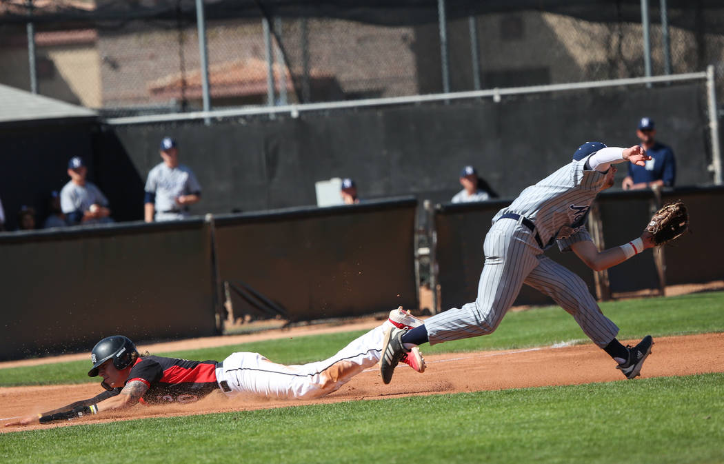 UNLV infielder Bryson Stott (10) slides into third base as UNR utility player Conor Allard (3) misses a pass in the fifth inning during an NCAA baseball game at Earl E. Wilson Stadium in Las Vegas ...
