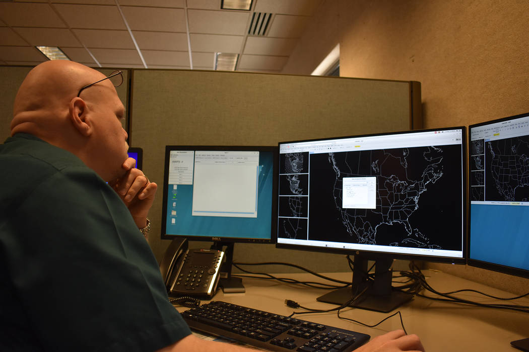 Daniel Berc, warning coordination meteorologist at the Las Vegas forecast office, at an old work station looking at forecast data on Friday, March 1. (Rachel Spacek/Las Vegas Review-Journal @Rache ...