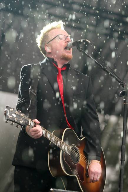 Dave King of Flogging Molly performs in a downpour at the Austin City Limits Music Festival in Austin, Texas on Saturday, Oct. 3, 2009. (AP Photo/Jack Plunkett)