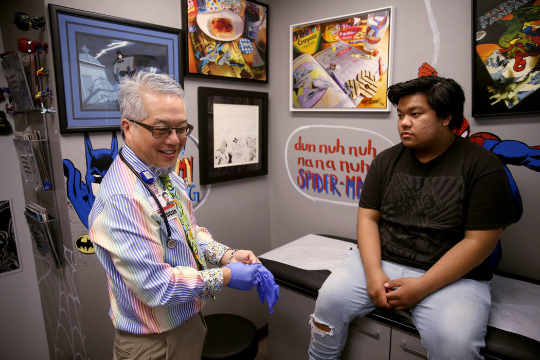 Pulmonologist Dr. Craig Nakamura, director of the Cystic Fibrosis Center of Southern Nevada, examines Rhuniel Getalado, 15, in his Las Vegas office Thursday, March 7, 2019. (K.M. Cannon/Las Vegas ...