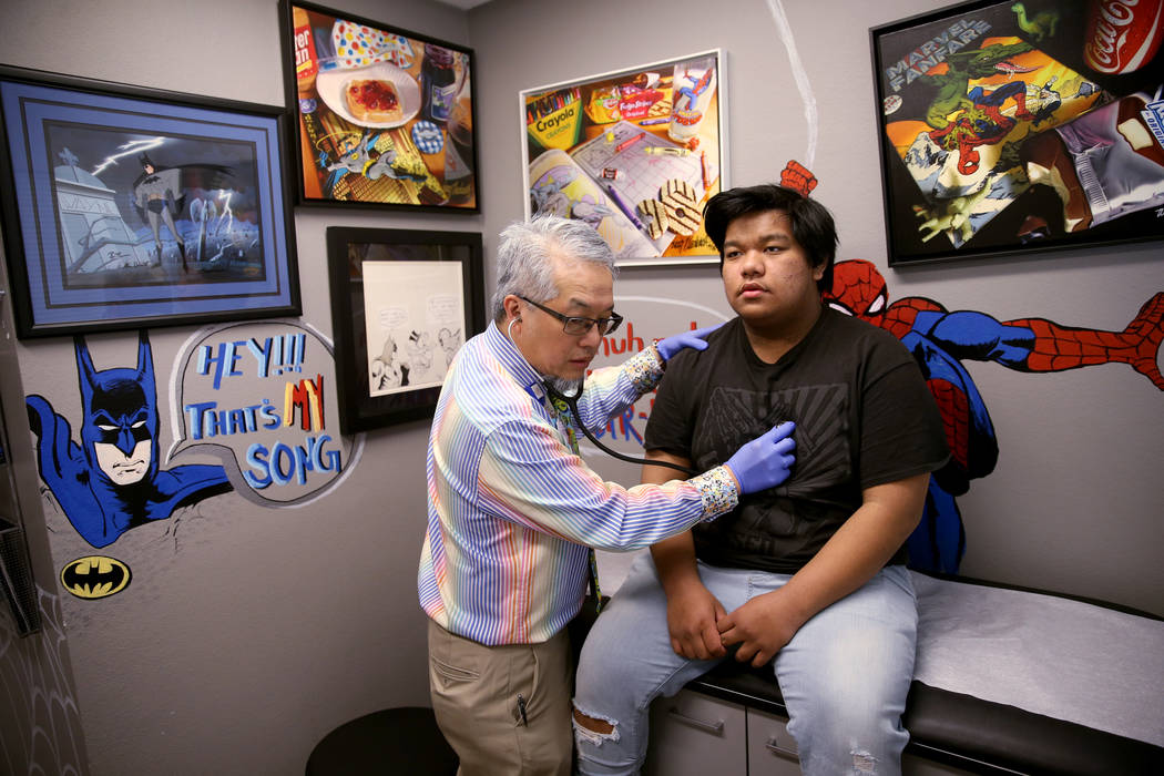 Pulmonologist Dr. Craig Nakamura, director of the Cystic Fibrosis Center of Southern Nevada, examines Rhuniel Getalado, 15, in his Las Vegas office Thursday, March 7, 2019. (K.M. Cannon/Las Vegas ...