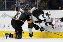 Vegas Golden Knights defenseman Brayden McNabb (3) checks San Jose Sharks right wing Joonas Donskoi (27) during the second period of an NHL hockey game Saturday, Nov. 24, 2018, in Las Vegas. (AP P ...