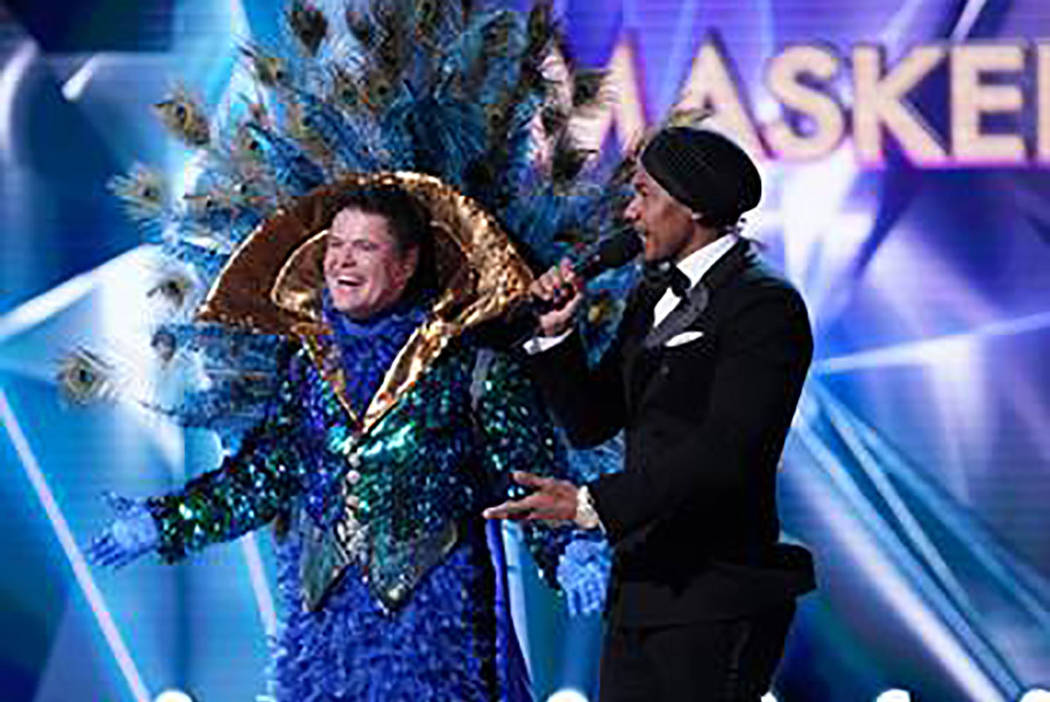 The Peacock is revealed as Donny Osmond during "The Masked Singer." With Osmond is host Nick Cannon. (Fox)