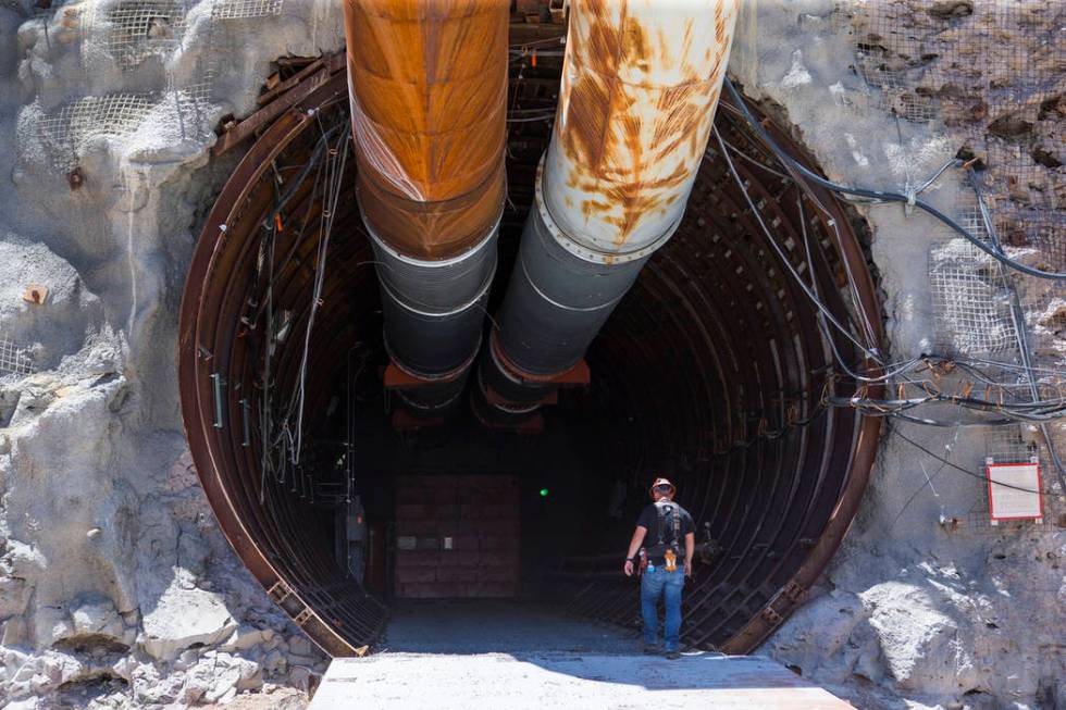 A contractor walks into the south portal of Yucca Mountain during a congressional tour near Mercury on Saturday, July 14, 2018. Chase Stevens Las Vegas Review-Journal @csstevensphoto