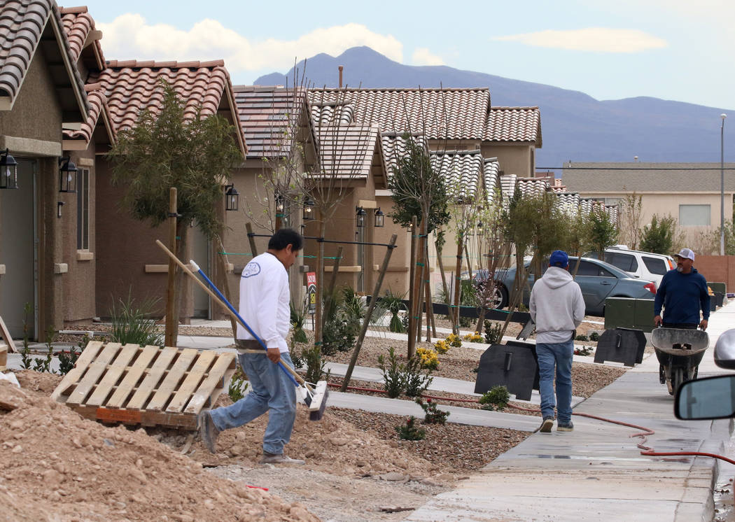 Construction workers at a new LGI Homes construction site at the Intersection of E. Lake Mead Boulevard and Dolly Lane photographed on Friday, March. 8, 2019, in Las Vegas. Bizuayehu Tesfaye Las V ...