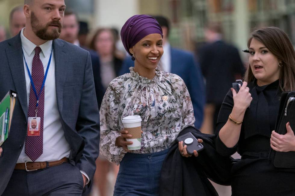 Rep. Ilhan Omar, D-Minn., walks through an underground tunnel at the Capitol as top House Democrats plan to offer a measure that condemns anti-Semitism in the wake of controversial remarks by the ...