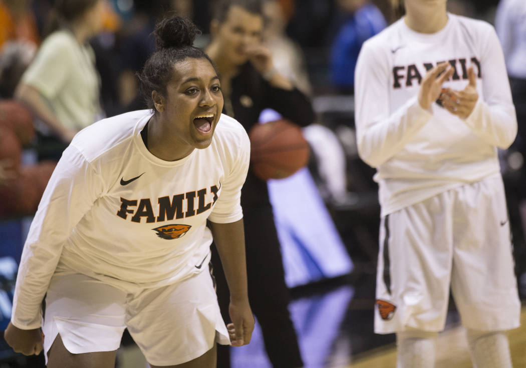 Oregon State junior guard Madison Washington, left, a Las Vegas native and Bishop Gorman graduate, fires up her teammates during warmsups before the start of the Beavers Pac 12 Tournament game wit ...