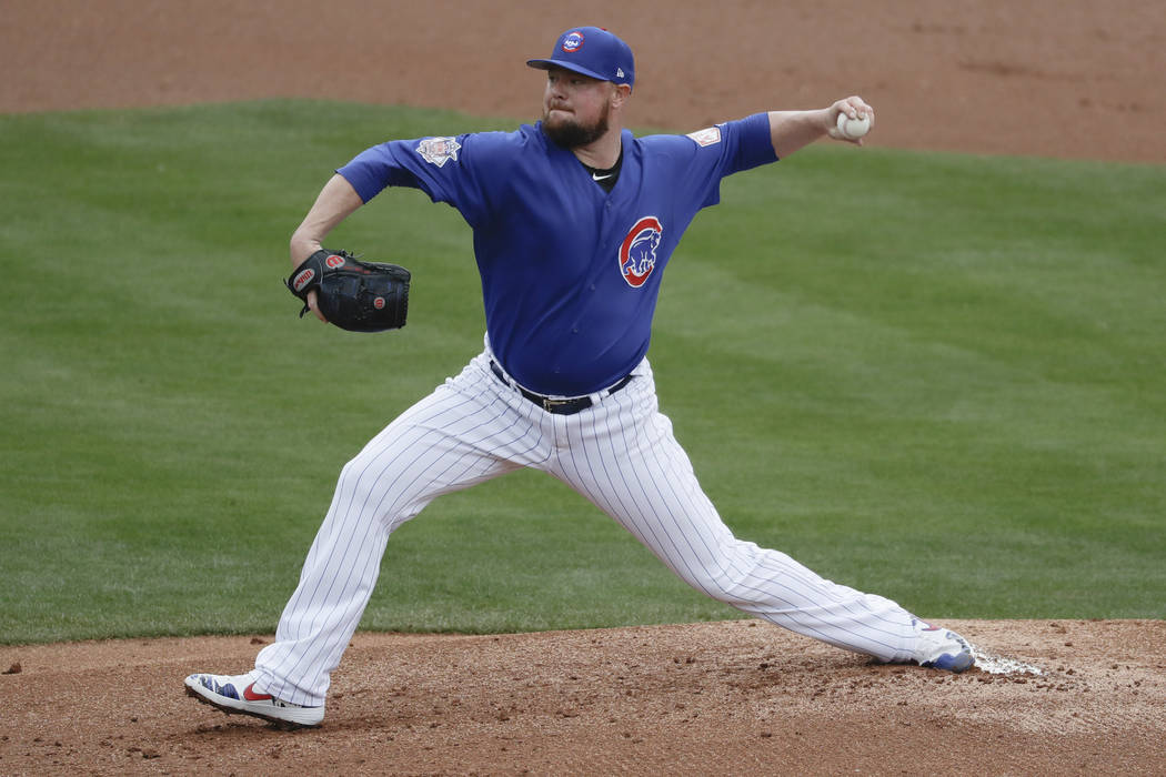 Chicago Cubs starting pitcher Jon Lester throws against the Milwaukee Brewers during the first inning of a spring baseball game in Mesa, Ariz., Saturday, March 2, 2019. (AP Photo/Chris Carlson)
