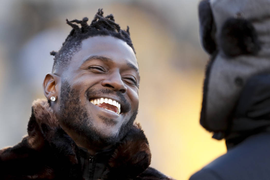 In this photo from Dec. 30, 2018, Pittsburgh Steelers wide receiver Antonio Brown, left, talks to former Steelers quarterback Charlie Batch as he stands on the sideline before an NFL football game ...