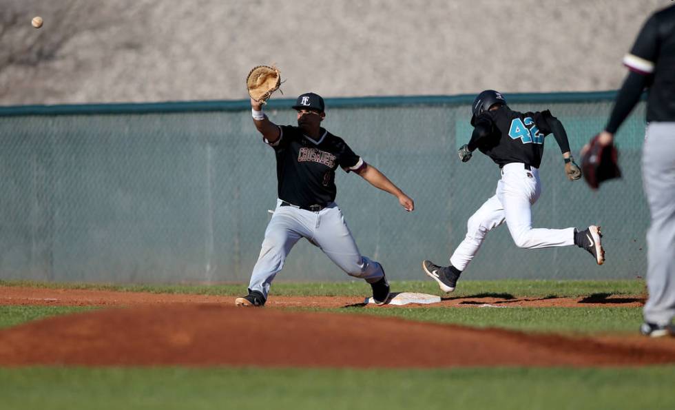 Silverado baserunner Caleb Hubbard (42) crosses first base as Faith Lutheran first baseman Jacob Ortega (8) waits for the throw during a baseball game at Silverado High School in Las Vegas Friday, ...