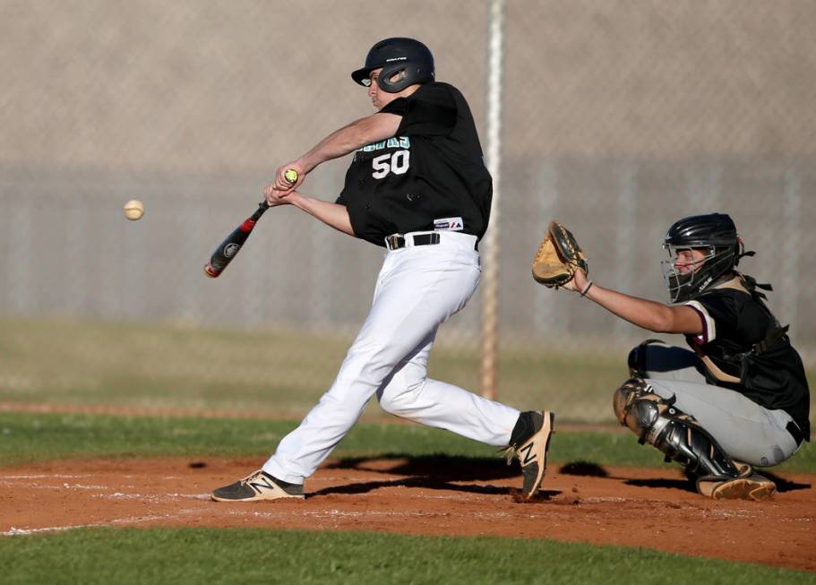 Silverado's Russell Macias (50) swings at a pitch as Carson Bonus catches during a baseball game at Silverado High School in Las Vegas Friday, March 8, 2019. (K.M. Cannon/Las Vegas Review-Journal) ...