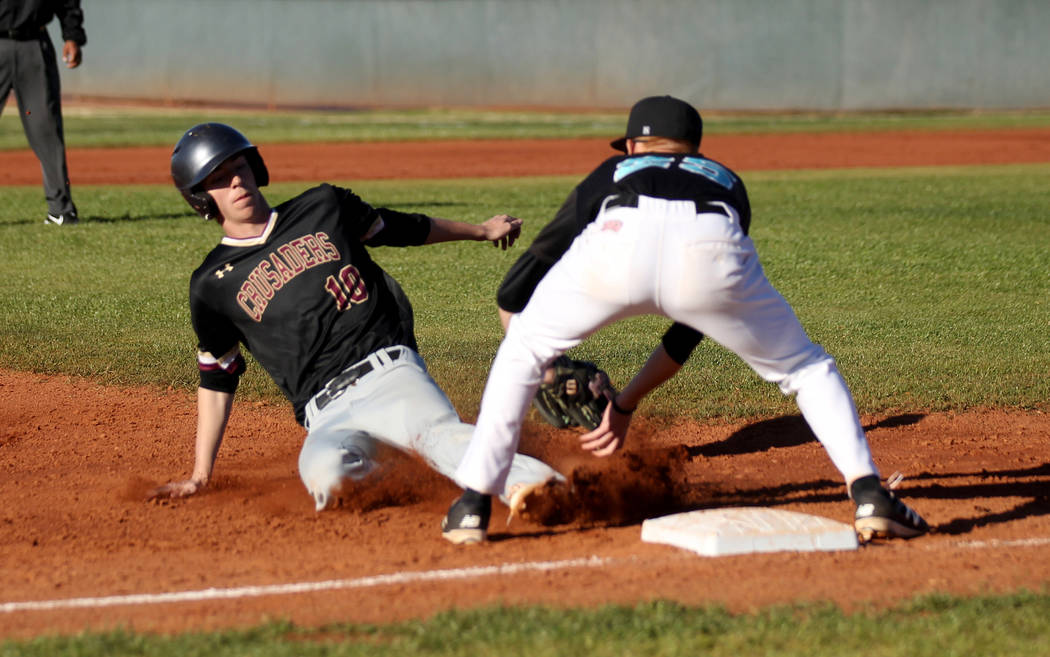 Silverado third baseman Austin Whittaker (25) tags out Faith Lutheran baserunner Michael Carroll (10) during a baseball game at Silverado High School in Las Vegas Friday, March 8, 2019. (K.M. Cann ...