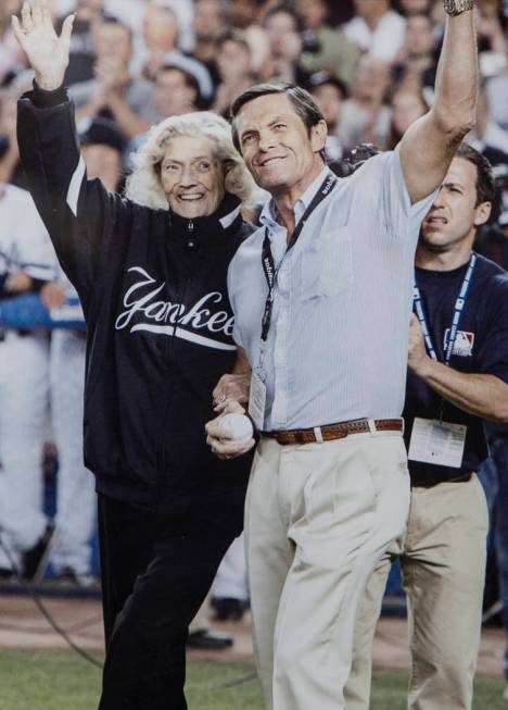 A photo of Julia Ruth Stevens, left, the daughter of New York Yankee Hall of Fame slugger Babe Ruth, and son Tom Stevens waving to fans before Ruth Stevens threw out the first pitch at the last ga ...