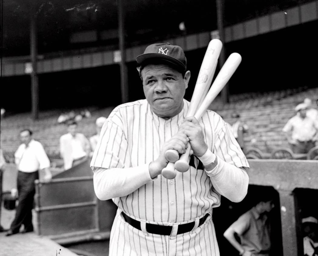 Retired Yankees slugger Babe Ruth warms up with three bats before stepping to the plate at New York's Yankee Stadium, August 21, 1942, as he prepared for a hitting exhibition. (AP Photo/Tom Sande)