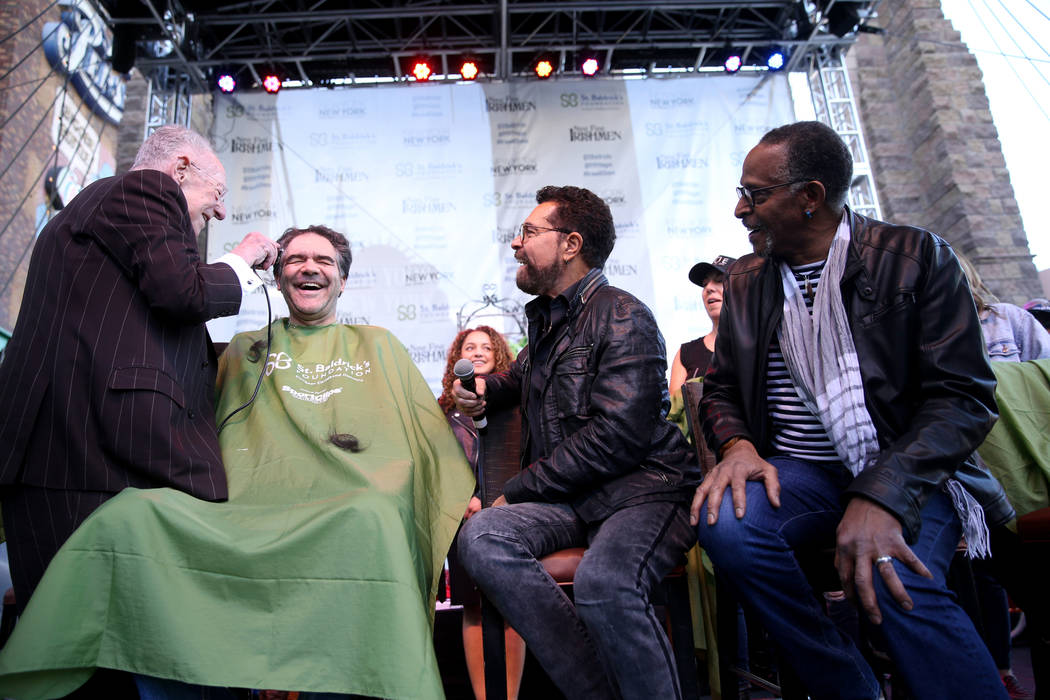 Las Vegas Review-Journal man-about-town columnist John Katsilometes gets his head shaved by former Las Vegas Mayor Oscar Goodman during St. Baldrick's Foundation shave-a-thon on the Brooklyn Bridg ...