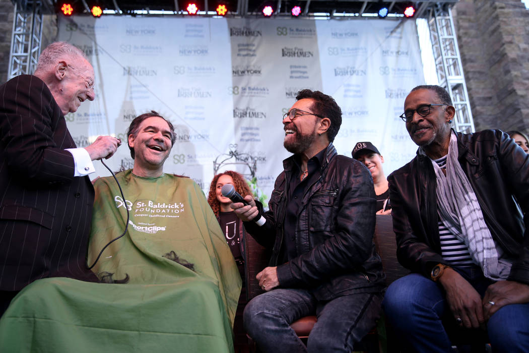 Las Vegas Review-Journal man-about-town columnist John Katsilometes gets his head shaved by former Las Vegas Mayor Oscar Goodman during St. Baldrick's Foundation shave-a-thon on the Brooklyn Bridg ...