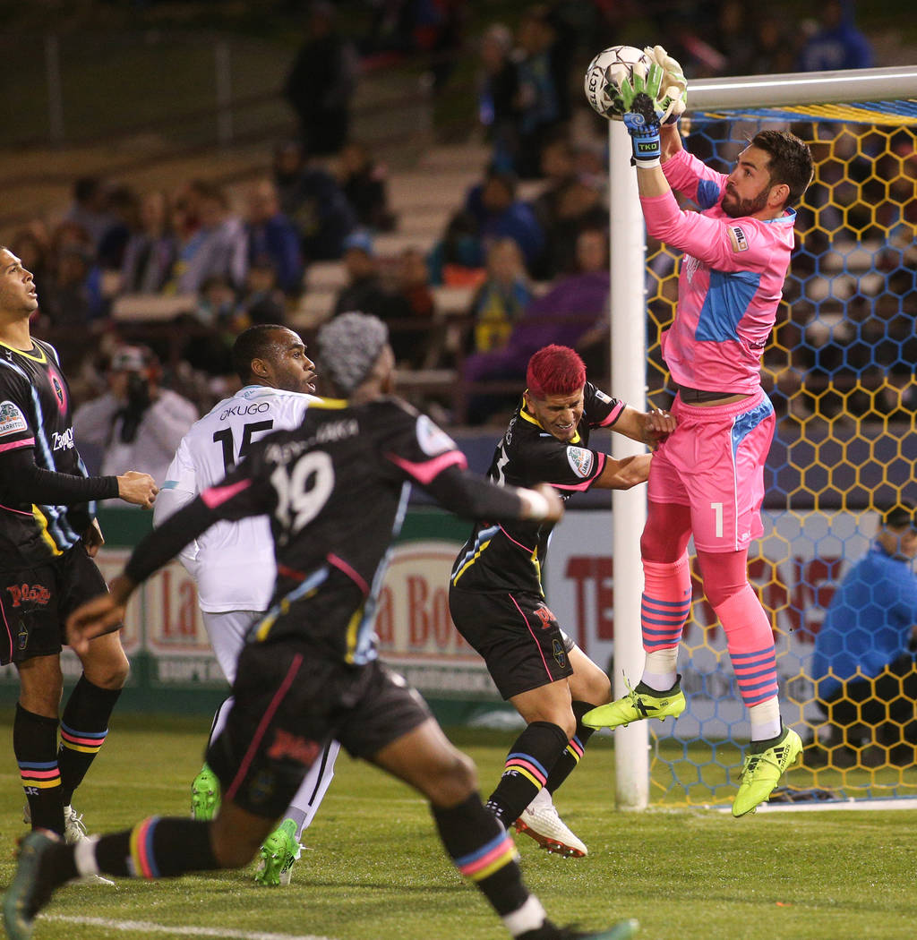 Las Vegas Lights FC goalkeeper Thomas Olsen (1) stops the ball in front of the goal during the second half of a United Soccer League match at Cashman Field in Las Vegas, Saturday, March 9, 2019. ( ...