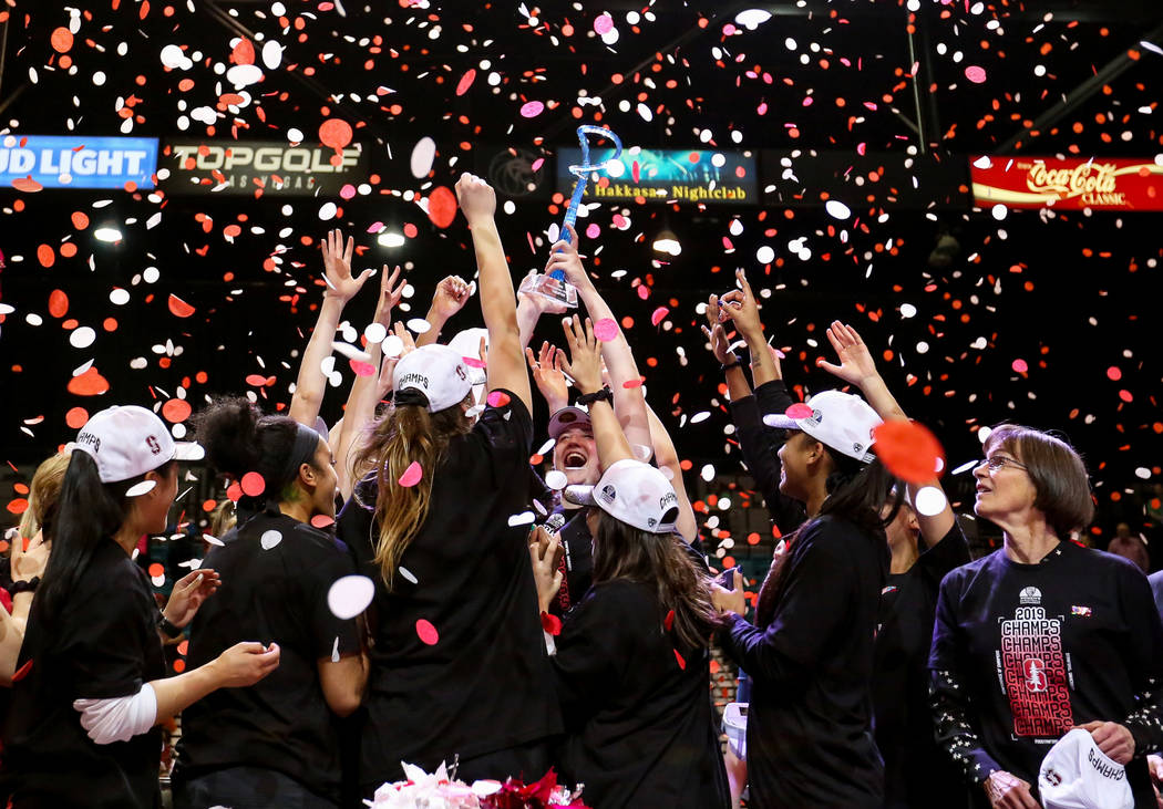 The Stanford Cardinals celebrate after defeating the Oregon Ducks during a NCAA college basketball game in the final of the Pac-12 women's tournament at the MGM Grand Garden Arena in Las Vegas, Su ...