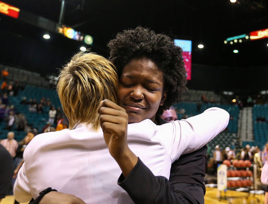Stanford Cardinal forward Nadia Fingall (4) hugs Associate Head Coach Kate Paye during the second half of an NCAA college basketball game at the Pac-12 women's tournament at the MGM Grand Garden A ...